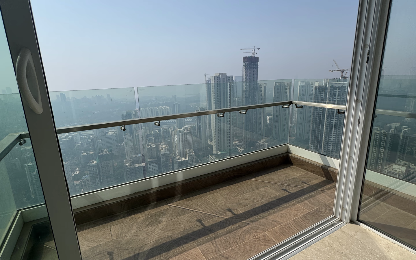 3 BHK for rent in Monte South, Byculla West - balcony with skyline view from the 59th floor